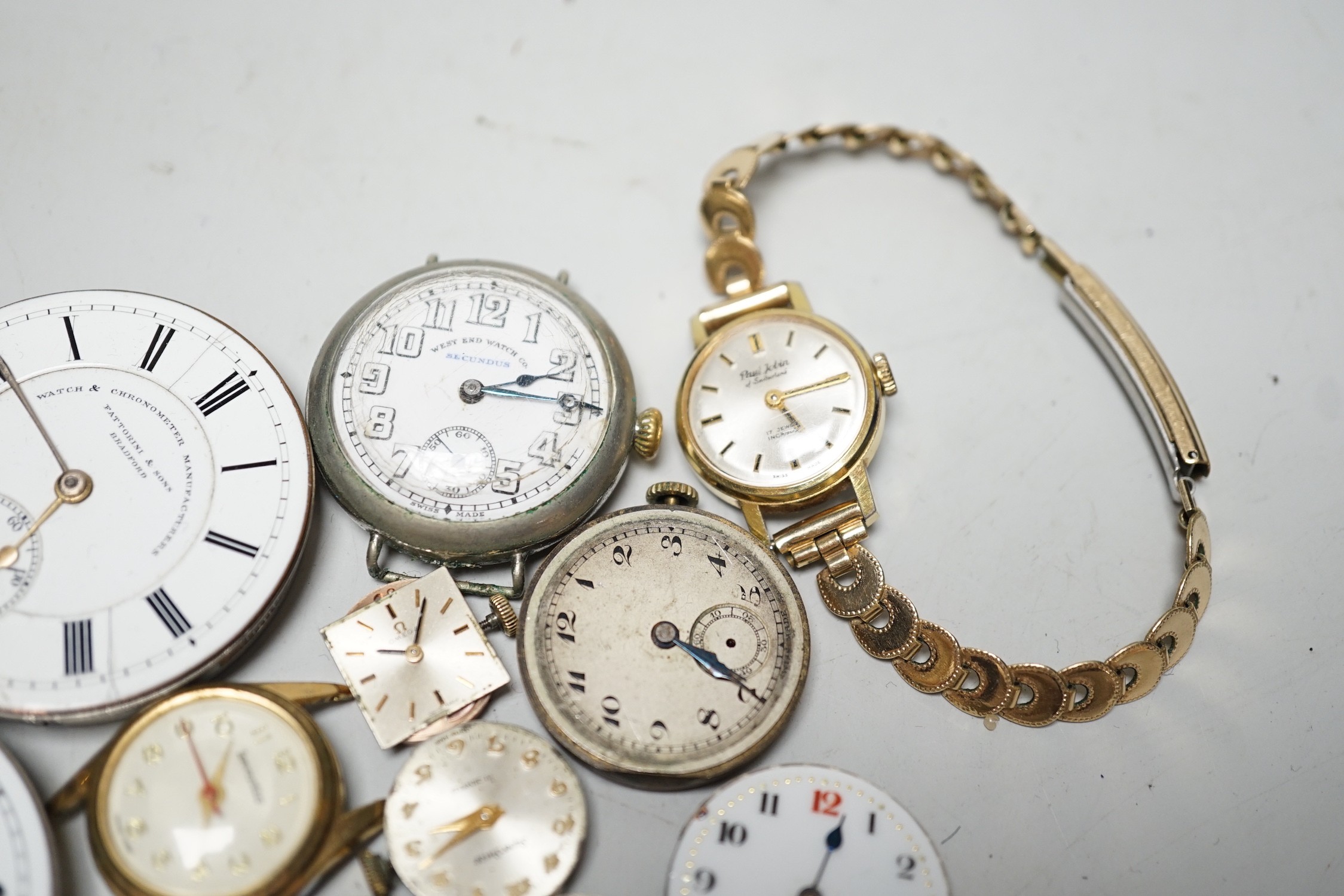 A collection of assorted wrist and pocket watch parts.